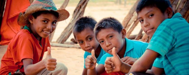 Cheerful boys from Goajira province in Colombia showing their thumbs up.