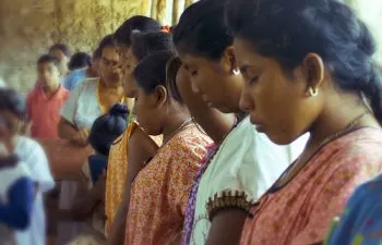 Wayuu ladies praying at local church